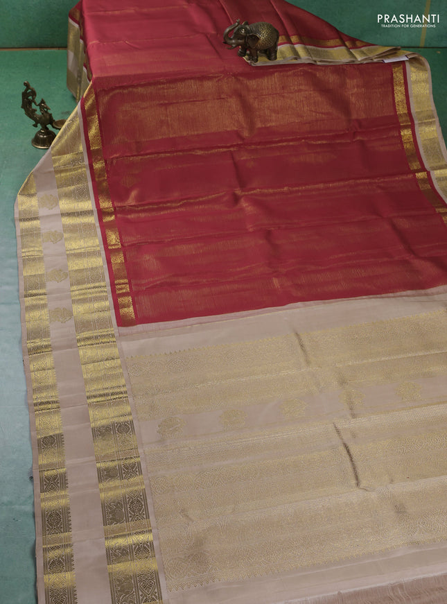 Pure kanchipuram silk saree red and beige with allover zari stripes pattern and rettapet zari woven border