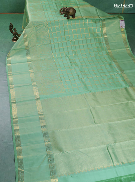 Pure kanchipuram silk saree pastel green with allover zari checked pattern and rettapet zari woven border