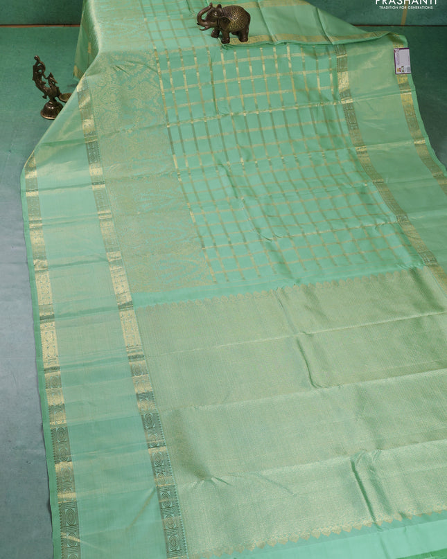 Pure kanchipuram silk saree pastel green with allover zari checked pattern and rettapet zari woven border