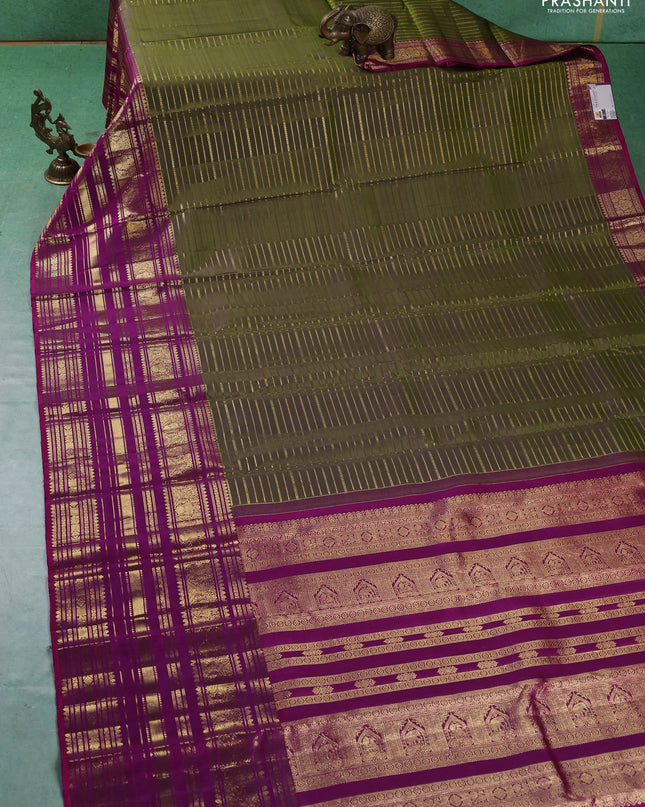 Pure kanchipuram silk saree mehendi green and purple with allover zari stripes pattern and long zari woven border