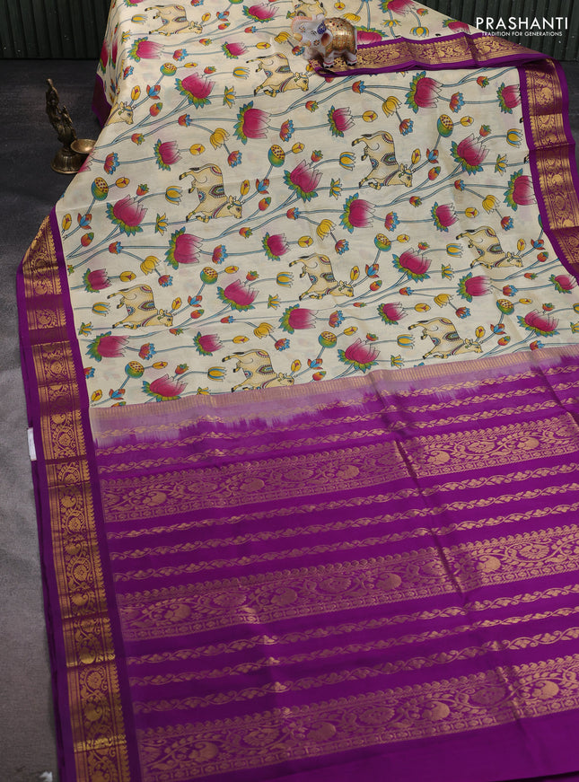 Silk cotton saree cream and purple with allover kalamakri prints and zari woven korvai border