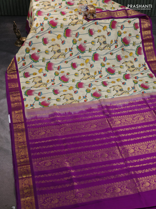 Silk cotton saree cream and purple with allover kalamakri prints and zari woven korvai border