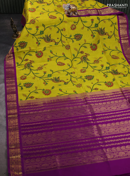 Silk cotton saree yellow and purple with allover kalamakri prints and zari woven korvai border