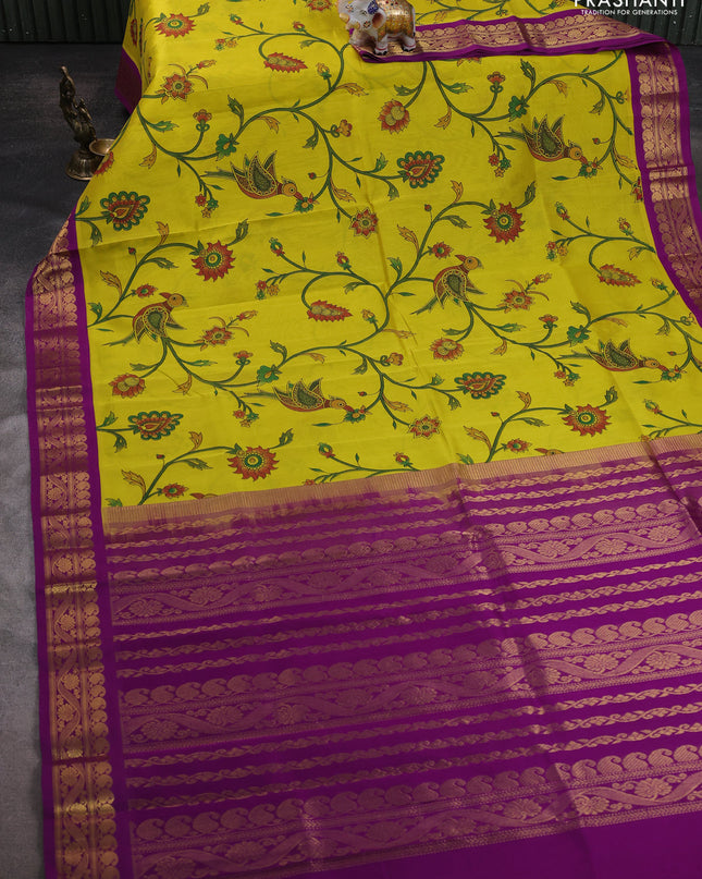Silk cotton saree yellow and purple with allover kalamakri prints and zari woven korvai border