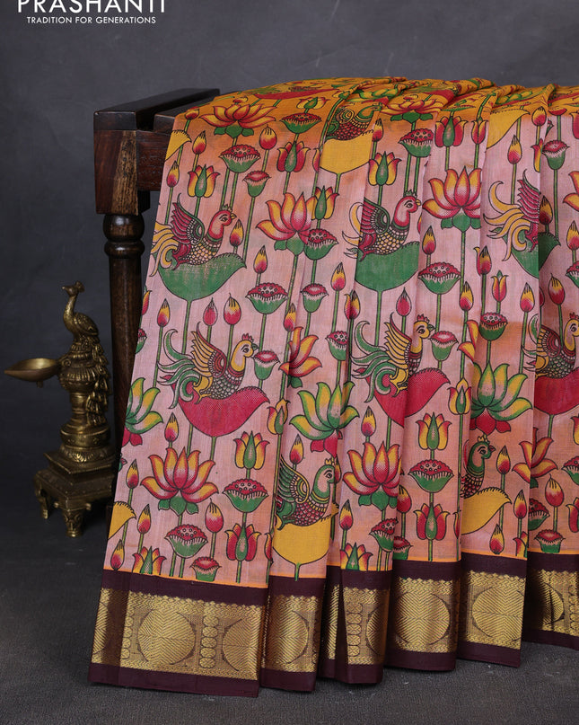 Silk cotton saree peach shade and coffee brown with allover kalamakri prints and zari woven korvai border