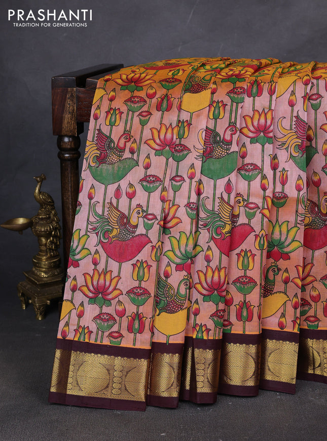 Silk cotton saree peach shade and coffee brown with allover kalamakri prints and zari woven korvai border