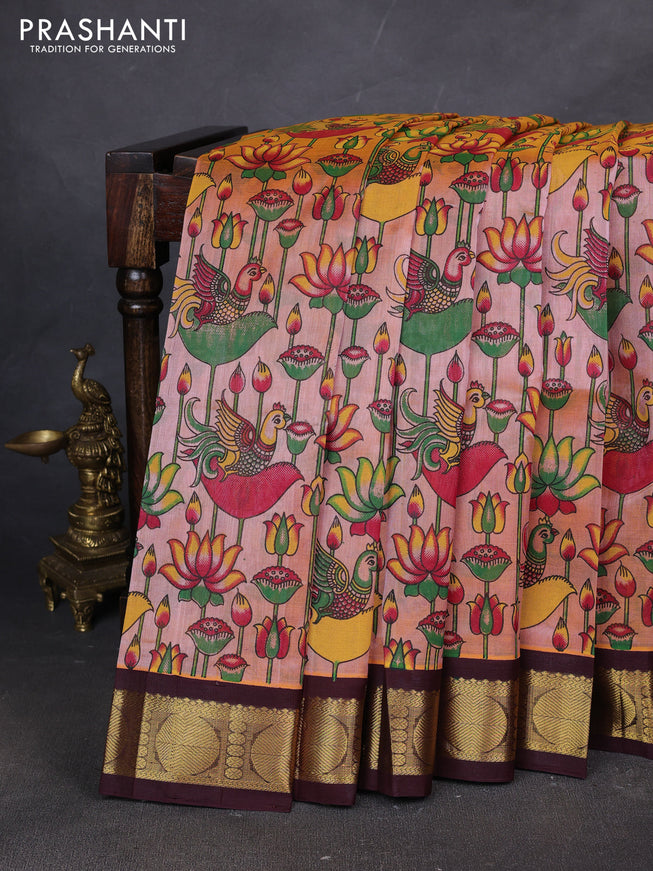 Silk cotton saree peach shade and coffee brown with allover kalamakri prints and zari woven korvai border