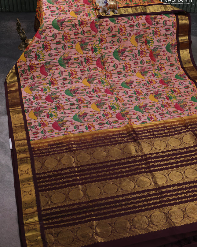 Silk cotton saree peach shade and coffee brown with allover kalamakri prints and zari woven korvai border