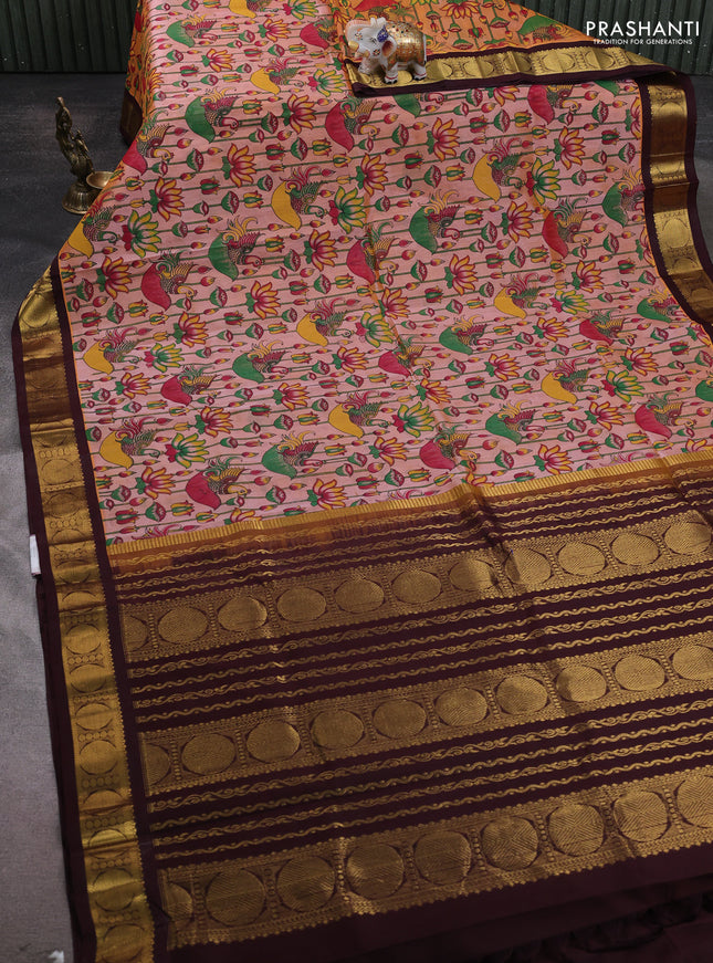 Silk cotton saree peach shade and coffee brown with allover kalamakri prints and zari woven korvai border