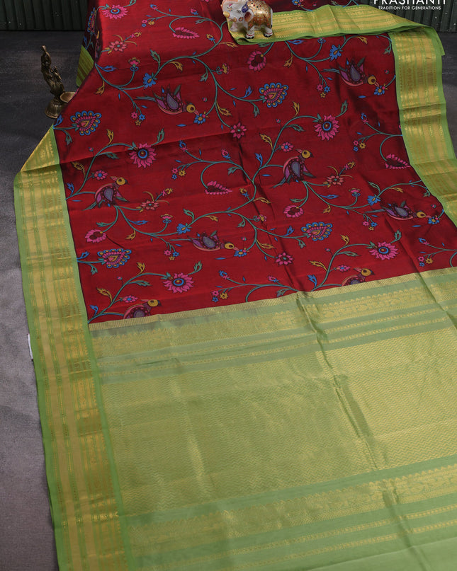Silk cotton saree maroon and light green with allover kalamakri prints and zari woven korvai border