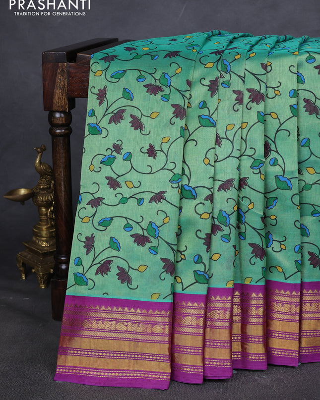 Silk cotton saree teal green and purple with allover kalamakri prints and zari woven korvai border