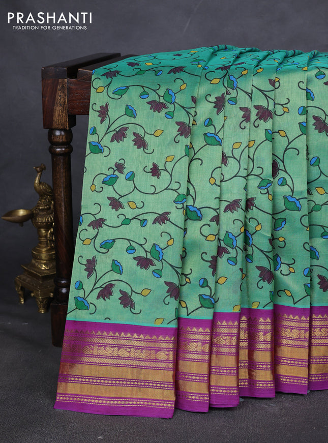 Silk cotton saree teal green and purple with allover kalamakri prints and zari woven korvai border
