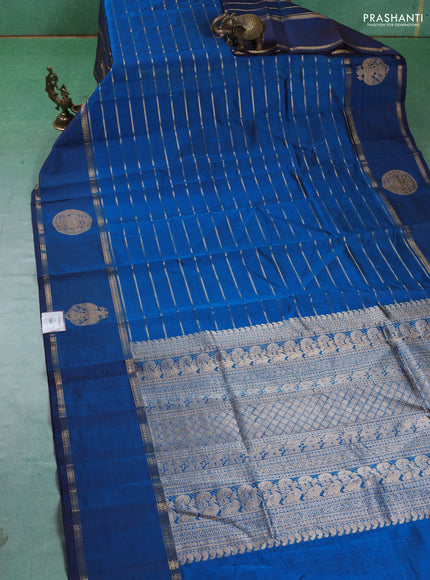 Kanchipuram silk cotton saree cs blue with allover zari stripes pattern and rettapet zari woven butta border