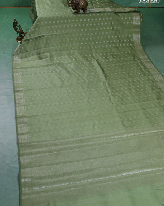 Chiniya silk saree pastel green with zari woven buttas and zari woven border