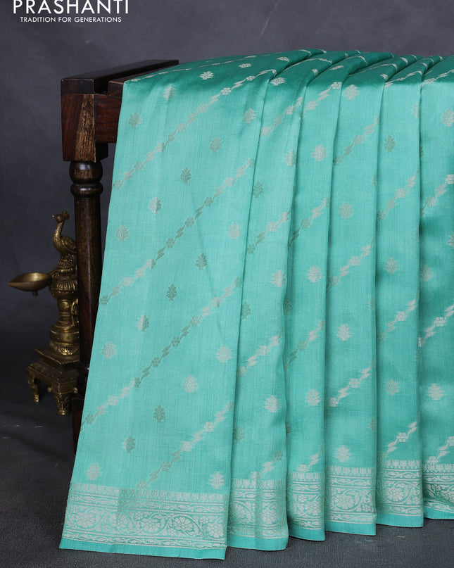 Chiniya silk saree teal green shade with allover silver zari weaves and zari woven border