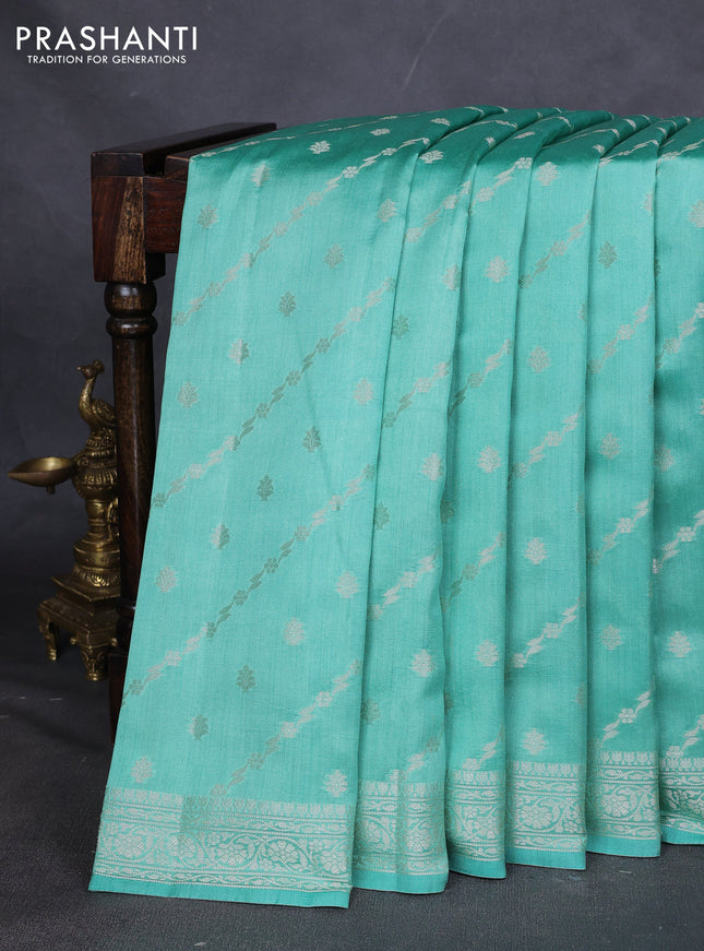 Chiniya silk saree teal green shade with allover silver zari weaves and zari woven border