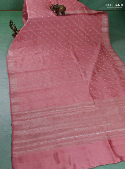 Chiniya silk saree peach shade with allover silver zari weaves and zari woven border