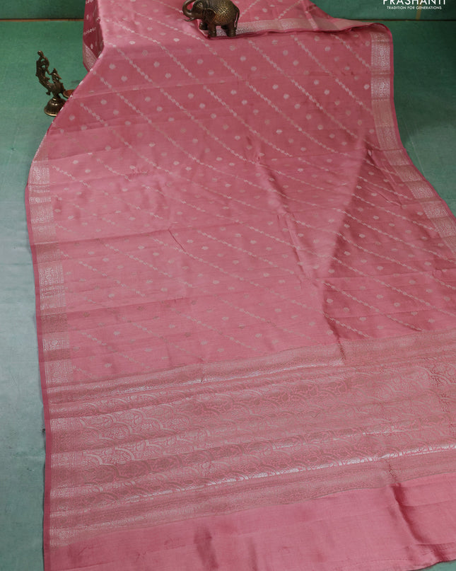 Chiniya silk saree peach shade with allover silver zari weaves and zari woven border