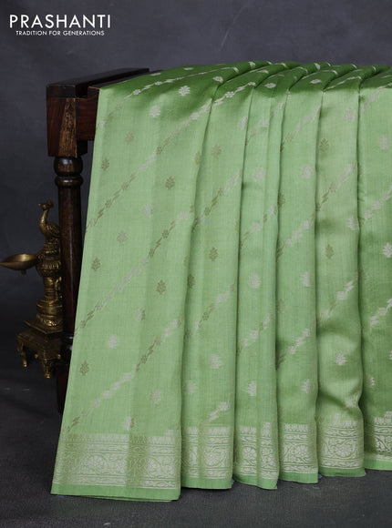 Chiniya silk saree pastel green with allover silver zari weaves and zari woven border