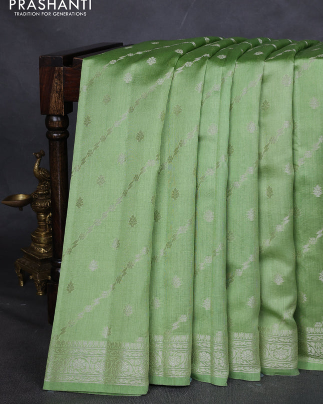 Chiniya silk saree pastel green with allover silver zari weaves and zari woven border