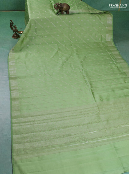 Chiniya silk saree pastel green with allover silver zari weaves and zari woven border