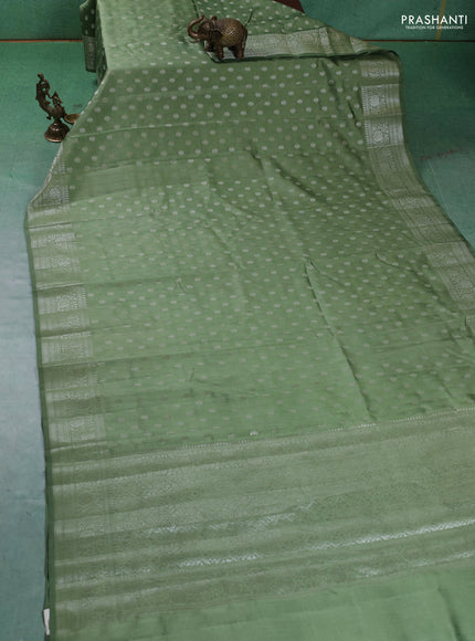 Chiniya silk saree pastel green with zari woven buttas and zari woven border