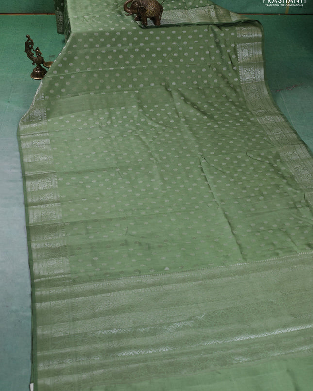 Chiniya silk saree pastel green with zari woven buttas and zari woven border