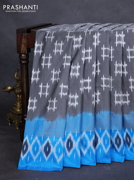 Pure pochampally silk saree grey and cs blue with allover ikat weaves and zari woven simple border