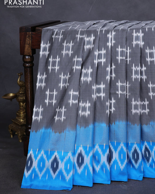Pure pochampally silk saree grey and cs blue with allover ikat weaves and zari woven simple border