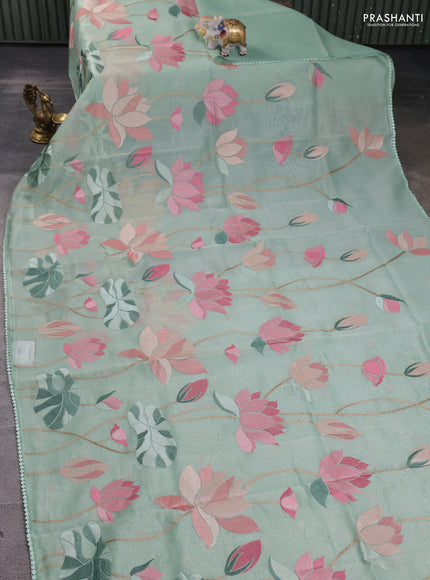 Art tissue chanderi saree pastel green with allover floral embroidery and lace work border