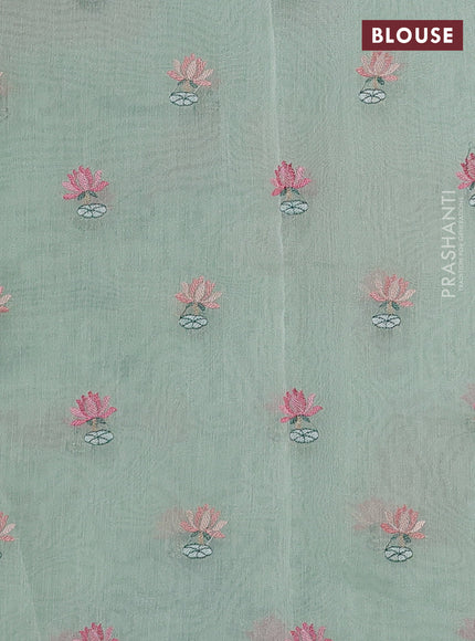 Art tissue chanderi saree pastel green with allover floral embroidery and lace work border
