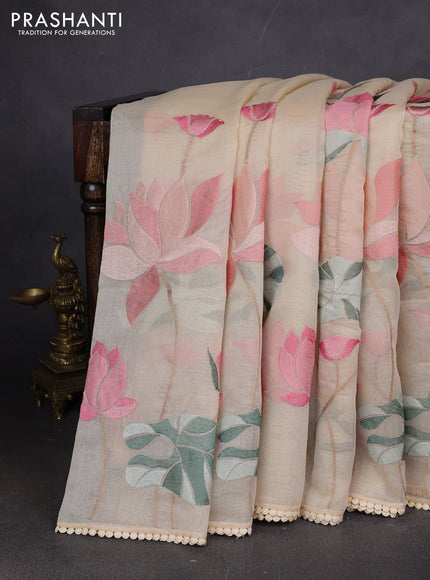 Art tissue chanderi saree cream with allover floral embroidery and lace work border