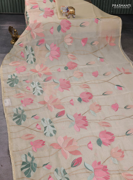 Art tissue chanderi saree cream with allover floral embroidery and lace work border