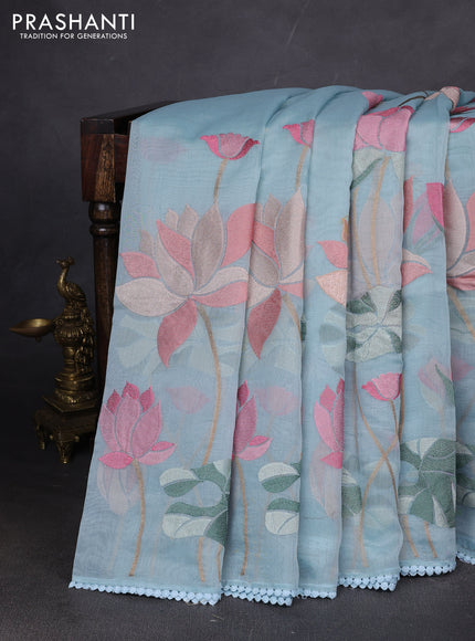 Art tissue chanderi saree light blue with allover floral embroidery and lace work border