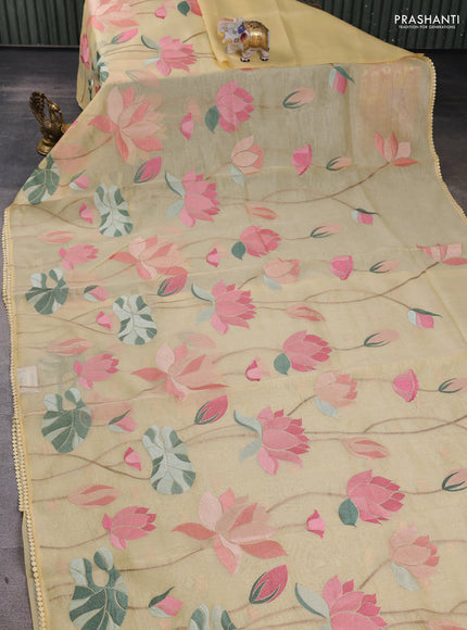 Art tissue chanderi saree pale yellow with allover floral embroidery and lace work border