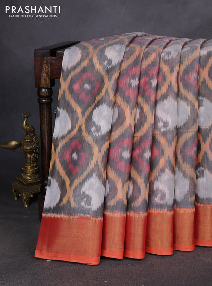 Ikat silk cotton saree grey and pinkish orange with allover ikat weaves and zari woven border
