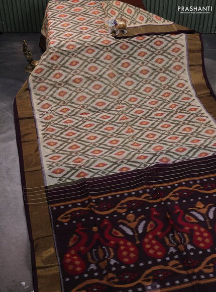 Ikat silk cotton saree cream and deep wine with allover ikat weaves and zari woven border