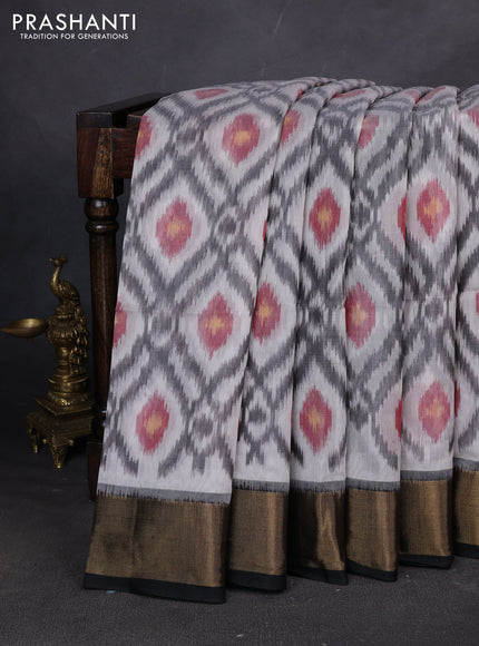 Ikat silk cotton saree off white and black with allover ikat weaves and zari woven border