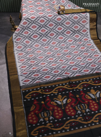 Ikat silk cotton saree off white and black with allover ikat weaves and zari woven border