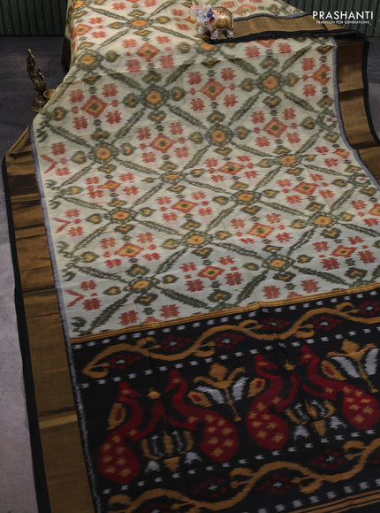 Ikat silk cotton saree pista green and black with allover ikat weaves and zari woven border