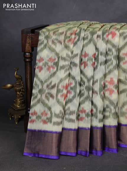 Ikat silk cotton saree pista green and violet with allover ikat weaves and zari woven border