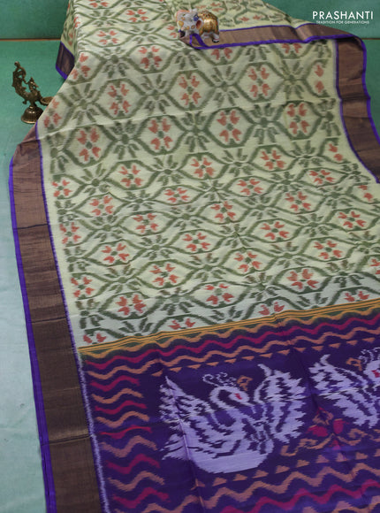 Ikat silk cotton saree pista green and violet with allover ikat weaves and zari woven border