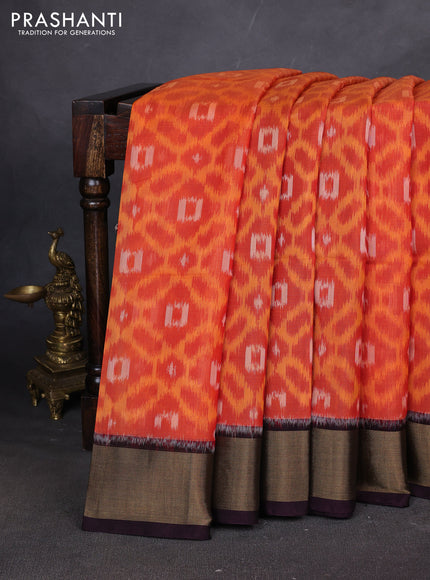Ikat silk cotton saree orange and deep jamun with allover ikat weaves and zari woven border