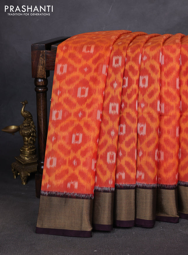 Ikat silk cotton saree orange and deep jamun with allover ikat weaves and zari woven border
