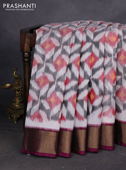 Ikat silk cotton saree off white and dark magenta pink with allover ikat weaves and zari woven border