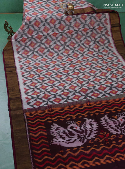 Ikat silk cotton saree off white and dark magenta pink with allover ikat weaves and zari woven border