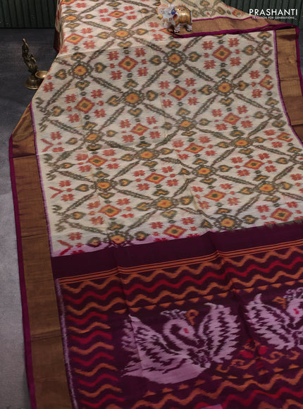 Ikat silk cotton saree cream and magenta pink with allover ikat weaves and zari woven border