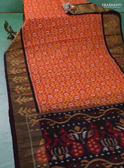 Ikat silk cotton saree orange and deep wine with allover ikat weaves and ikat woven zari border