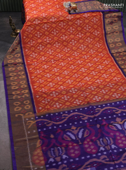 Ikat silk cotton saree orange and blue with allover ikat weaves and ikat woven zari border