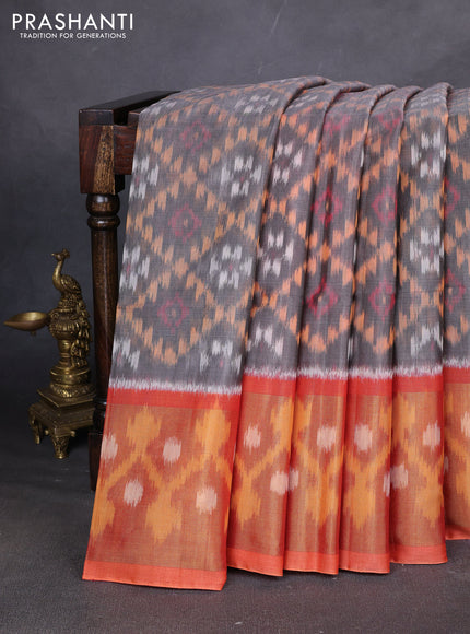 Ikat silk cotton saree grey and orange with allover ikat weaves and ikat woven zari border